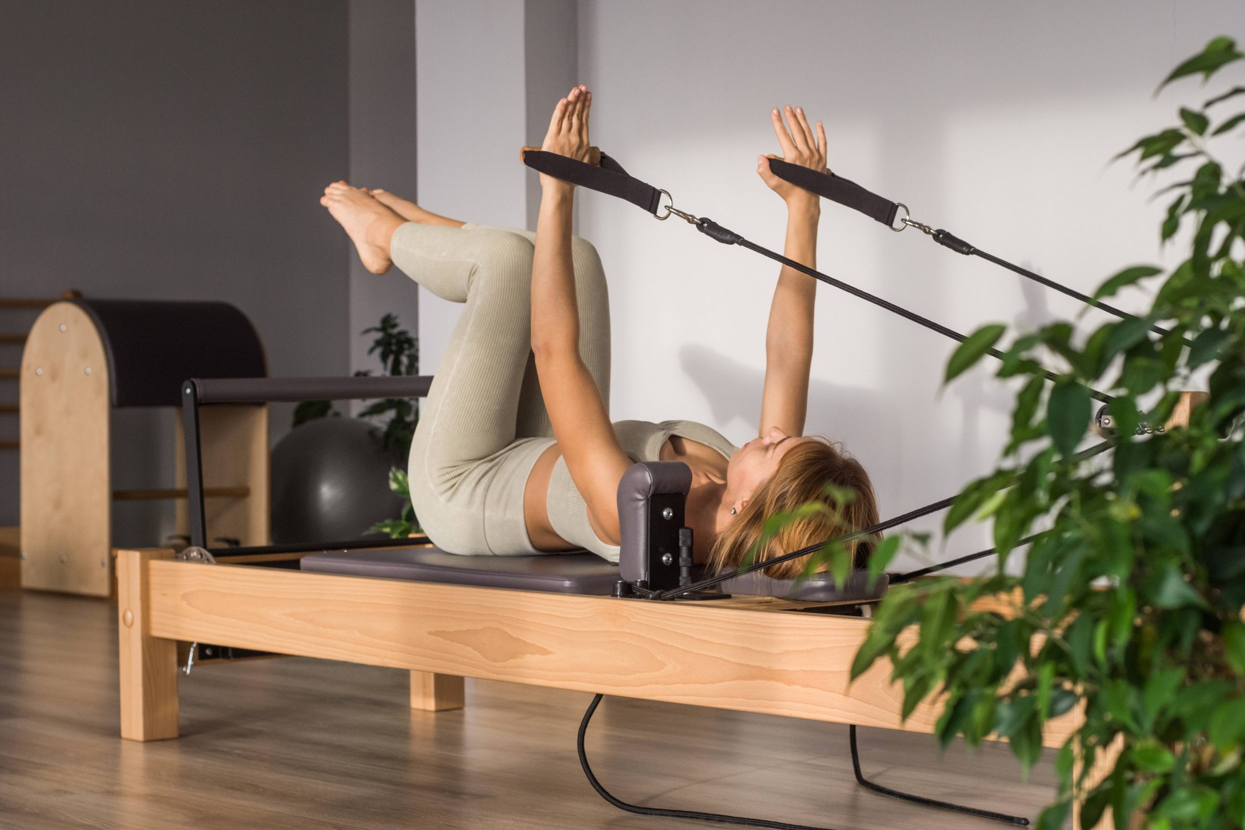 Woman doing Pilates exercises at Seaford Physio and Pilates Clinic in Adelaide